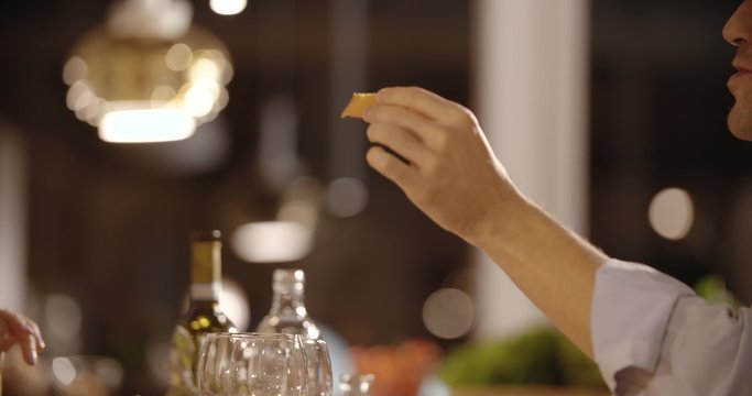 Couple have dinner at home in the evening close-up in slow motion (in realtime at 60 fps)