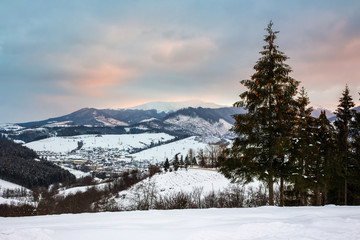 red winter sunset in mountains village