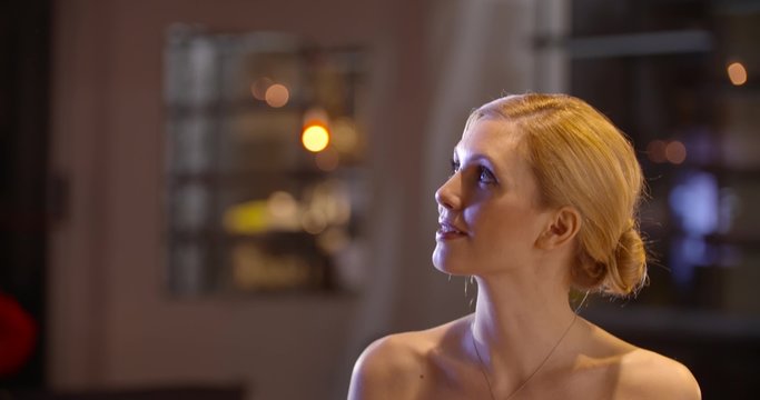 Beautiful elegant couple have dinner in the evening at restaurant in slow motion (in realtime at 60 fps)