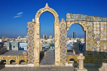 Wall murals Tunisia Tunisia. Tunis - old town (medina) seen from roof top. Ornamental arches and wall covered tiles with geometric shape motifs