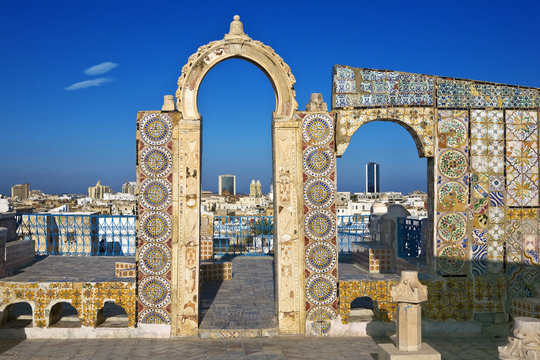 Tunisia. Tunis - old town (medina) seen from roof top. Ornamental arches and wall covered tiles with geometric shape motifs