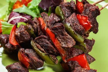 Grilled beef meat and vegetable kebabs