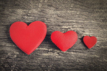 Fototapeta na wymiar Red heart with different size