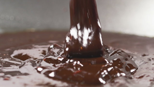 Delicious melted chocolate pouring 