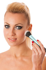 Portrait of woman holding beauty accessories, mascara, pauder br