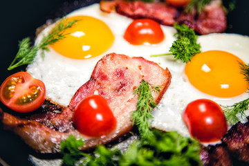 Fototapeta na wymiar Scrambled eggs with bacon delicious breakfast