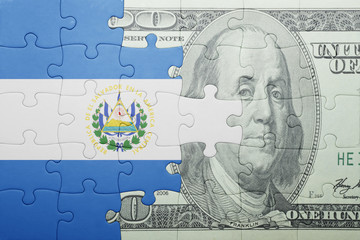puzzle with the national flag of el salvador and dollar banknote