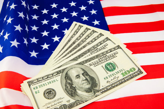 American dollars and flag