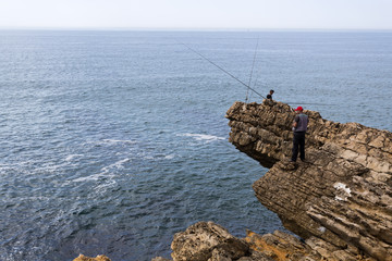 Fototapeta na wymiar Fishing Along Rugged Coast