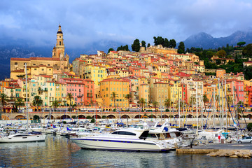 Fototapeta na wymiar Yachts in the marina of colorful medieval town Menton on french Riviera, France