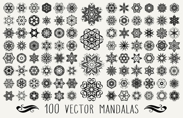 Fototapeta na wymiar Set of ornate lacy doodle floral round rosettes in black over white backgrounds. Mandalas formed with hand drawn calligraphic elements.
