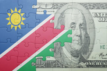 puzzle with the national flag of namibia and dollar banknote