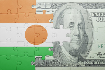 puzzle with the national flag of niger and dollar banknote