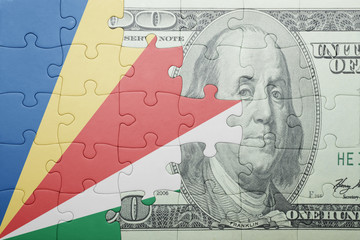 puzzle with the national flag of seychelles and dollar banknote