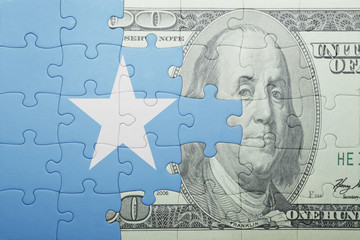 puzzle with the national flag of somalia and dollar banknote