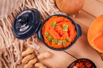 Pumpkin porridge with millet in the clay pot