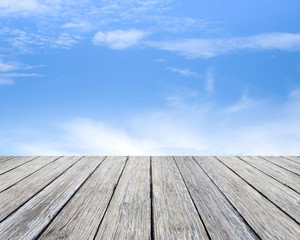 Wood table top on blue sky background  - used for display your products