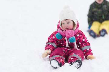 little girl at snowy winter day