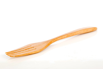 brown wooden forks on white background,selective focus
