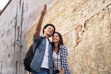 Fototapeta na wymiar Lovely tourist couple exploring the city