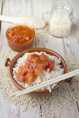Fototapeta na wymiar Mexican Rice - Rice cooked with tomato sauce