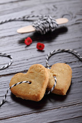 Heart shaped sugar cookies tied with rope.