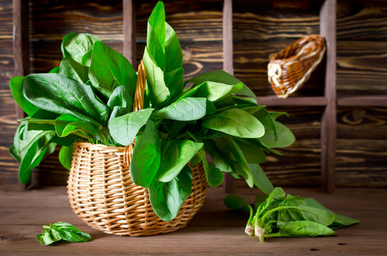 Fresh spinach in a basket on the table