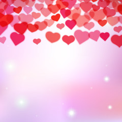 Valentines Day background with scattered blurred tender hearts