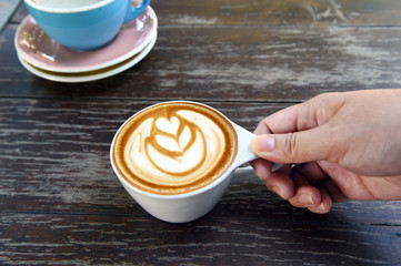a cup of latte art coffee.