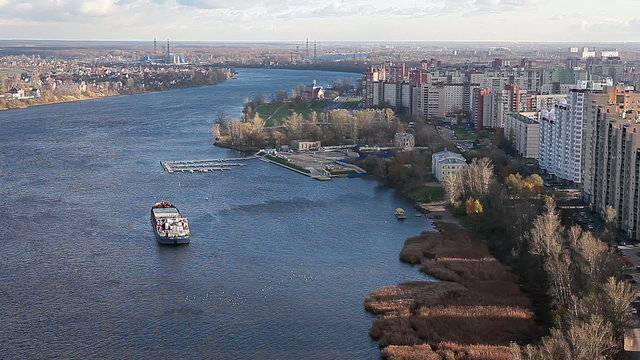Neva river with ship on it and embankment along in Saint-Petersburg, Russia
