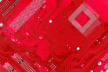 Red circuit board texture background of computer motherboard