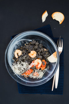 Black squid ink tagliatelle with tomatoes and shrimps