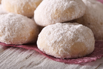 Fototapeta na wymiar polvorón cookies with powdered sugar macro on a table. horizontal 