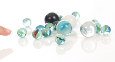 glass marbles balls on white blackground ,selective focus