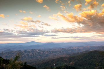 Fototapeta premium Mountain valleys in morning clouds at Sunrise