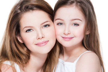 happy young mother with a small daughter 8 years