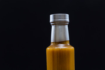 Bottle of Sauce on dark background