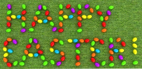 Easter eggs as a "Happy Easter" greeting on a green grass