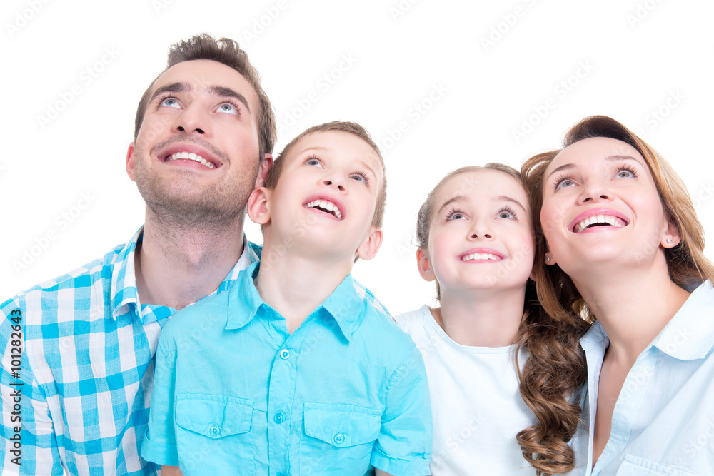 Wall mural Happy family with two children looking up