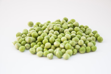 Green peas on wooden background
