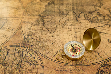 old compass  on vintage map