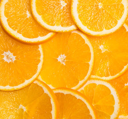 slices of oranges laid out in the form background