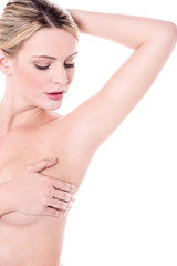 Obraz na płótnie Canvas Naked woman covering her breast