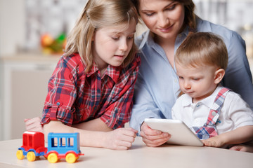 young mom playing with children