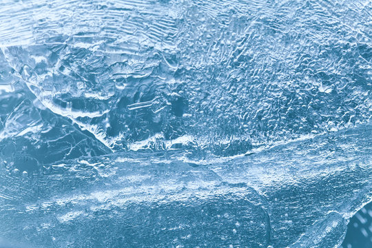Frozen blue ice surface texture, icy xmas background. macro view, soft focus