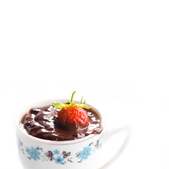 vintage cup of hot chocolate with strawberry. Macro view, soft focus, white background. copy space