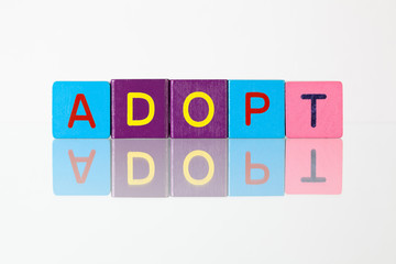 Adopt - an inscription from children's  blocks