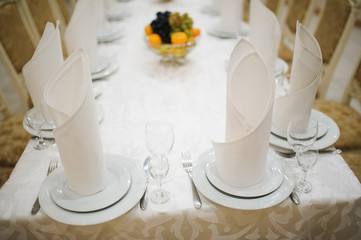 table setting with plate, spoon, fork and knife