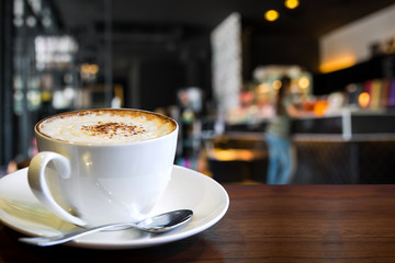 coffee cup with blur coffee shop background 