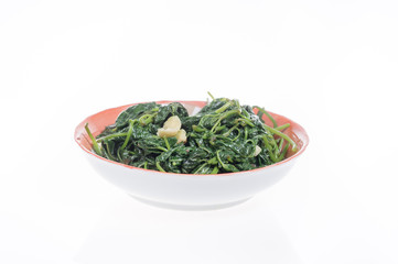 Fried sweet potato leaves on a white background